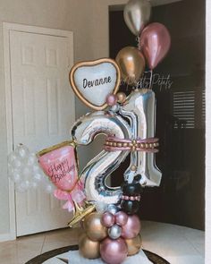 a birthday cake with balloons and the number twenty five