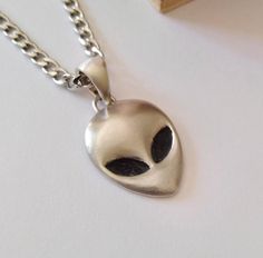 ★ Alien Head Pendant ★  Handcrafted Alien (Grey) Head pendant/necklace with a Flat Back for Men and Women. * Material/Finishes ➤ Artificially Aged (Black/Grey Oxidized) Silver 925 * Dimensions ➤ ~ 2.7 x 2.0 x 0.5 cm (~ 1.1 x 0.8 x 0.2 inches)/Bail: Suitable for up to ~ 4.5 mm (~ 0.18 inches) Chain * Weight: ~ 11 grams (in Silver 925) ----------------------------------------------------------------------------- IMPORTANT NOTES: --------------------------------------------------------------------- Ufo Jewelry, Material Finishes, Alien Necklace, Alien Head, Precious Jewels, Oxidized Silver, Stainless Steel Chain, Handmade Silver, Silver 925