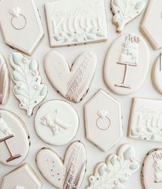 many decorated cookies are arranged on a table