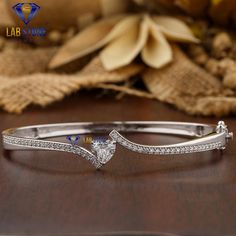 Welcome to our listing for a stunning Diamond Bracelet that will leave you truly mesmerized! We are blessed with 5000+ satisfied customer with great response. Bracelet-38 ✥ 𝐌𝐚𝐢𝐧 𝐒𝐭𝐨𝐧𝐞 𝐃𝐞𝐭𝐚𝐢𝐥𝐬 ↣ Shape : Heart & Round Cut ↣ Type : CVD/HPHT ↣ Weight - 1.48 TDW - 47 Diamond  (1.01ct Heart EF VS - 1 Diamond)  (0.01ct Round EF VS - 46 Diamond) ↣ Gold Weight (White Gold) : 10 K - 22.21 gm 14 K - 22.41 gm 18 K - 22.61 gm Comes in jewelry box  Celebrate your love story with a symbol as un Gold Bracelet Bangle, White Gold Bracelet, Gold Bangle Bracelet, Diamond Gold, Bracelet Bangle, Wedding Bracelet, Classic Wedding, Sparkle Diamonds, Wedding Classic