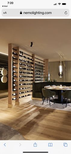 an iphone photo of a dining room with wine racks