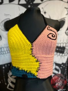 a crocheted top on a mannequin head