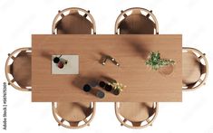 an overhead view of a wooden table and chairs