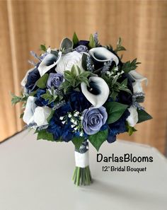 a bridal bouquet with blue and white flowers