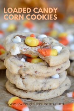 loaded candy corn cookies stacked on top of each other