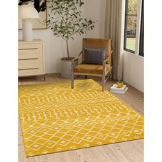 a yellow area rug in a living room with a brown chair and potted plant