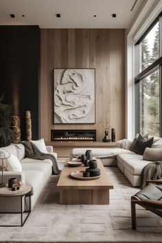 a living room filled with furniture and a large painting on the wall above the fireplace