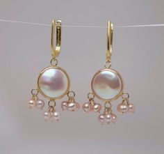 This is a Pair of 14K YG Pearl drop earring central disk pearl with 3 ring each suspending 3 pearls all of pinkish hue, signed jewel MAK, 12/3" drop. 6.6 grams Payment Through Paypal within 3 days of purchase.   I ship to U.S addresses only. No international shipping.  Please Note: Due to a high number of returns on Items for no other reason than the buyer changes their mind or they just don't like the item. I am now forced to Charge a 20% restocking fee. If the item you receive is not as pictur Gold Pearl Drop Earrings, Opal Moon Necklace, Seed Pearl Ring, Pearl Drop Earrings Gold, Drop Earring, Fine Jewellery Earrings, Pearl Drop Earrings, Opal Jewelry, Gold Pearl