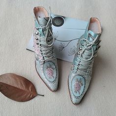 Brand Name: VangullShaft & Upper Material: SilkBoot Height: ANKLEFashion Element: EmbroideryPattern Type: FloralModel Number: MKBOO18033Toe Shape: Pointed ToeItem Type: BootsInsole Material: PolyurethaneOutsole Material: RubberHeel Height: 2 inchesClosure Type: Lace-upFit: Fits true to size, take your normal size Spring Embellished Boots With Round Toe, Blue Embroidered Spring Boots, Blue Embroidered Boots For Spring, Spring Embroidered Almond Toe Boots, Spring Embellished Leather Boots, Spring Leather Boots Embellished, Spring Leather Embellished Boots, Blue Boots, Design Shoes