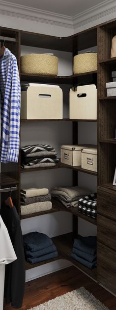 an organized closet with clothes and other items