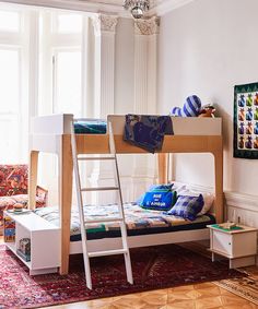 a bunk bed sitting in the middle of a living room