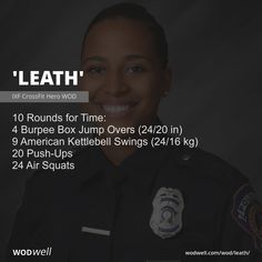 a woman police officer smiling for the camera with her name on it's chest