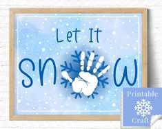 a handprinted snow sign with the words let it snow in blue and white