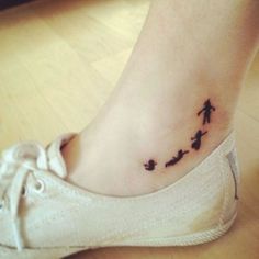 a person has a small tattoo on their foot that reads justmaltattoos