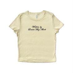 Baby tee with "Written by [Author Name]" embroidered in polyester thread. T-shirt will feature the font and colors shown in example photos. Available in natural w/ black lettering and black w/ pink lettering. A thoughtful gift for your bestie that loves to read. <3 Soft, mid-length shirt for the perfect baby tee fit! Fabrication: 52% Airlume combed and ring-spun cotton, 48% polyester 32 single, 5.4oz Want a different embroidery color? Message us! We have a large variety of colored thread to choose from. Fitted T-shirt With Embroidered Text And Short Sleeve, Embroidery Placement, Concert Vibes, Laura Prepon, Palm Bay, Baby T Shirts, National Anthem, Embroidered Shirt, Graphic Tees Women