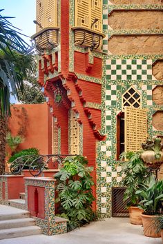 an elaborately decorated building with potted plants