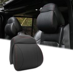 the interior of a car with black leather seats and red stitching on the side