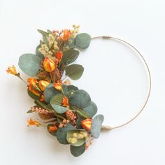 a headband with flowers and leaves on it