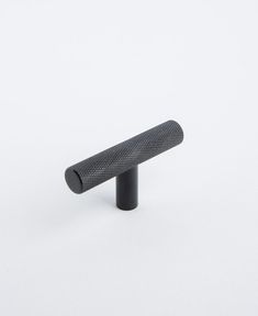 a black handle on a white background