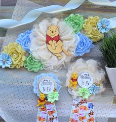 "Winnie the Pooh Baby Shower, Maternity Sash, Mommy To Be Ribbon, Daddy To Be Pin, Boy Baby Shower ❤ This Winnie the Pooh Sash & Pin Set were made especially for a Baby Shower or a Photo Prop. Details: * Maternity Sash: This has nine flowers in Light Green, Light Yellow, Cream, & Light Blue colors embellished with rhinestones and pearls. Additionally, this sash is decorated with lions animals. The ribbon sash is 80'' (2 meters) long. *Mommy to Be Pin: This pin measures approx. 11\" from top of t Winnie Poo, Mommy To Be Pins, Pooh Winnie, Baby Shower Sash, Winnie The Pooh Themes, Baby Shower Duck, Winnie The Pooh Baby Shower, Boy Baby Shower Ideas, Disney Baby Shower