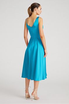 Experience the charm of the Hayden Dress, a luxurious satin A-line midi. Its asymmetrical cowl drape bodice and undulating pleats form a graceful, hypnotic silhouette, ideal for any elegant event. Cowl Neck A Line Silhouette Sleeveless Below Knee Length REF: 88111782 Sleeveless Satin Finish Pre-draped Dress, A-line Midi Dress With Pleated Back For Evening, Silk A-line Dress With Pleated Bodice, Pre-draped Satin Midi Dress For Spring, Chic A-line Satin Cocktail Dress, A-line Party Dress With Bias Cut, Elegant A-line Evening Dress With Ruched Bodice, Satin Pre-draped Dress With Fitted Bodice, Dressy A-line Midi Dress For Evening