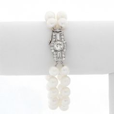 Double Strand Pearl Bracelet With Diamonds - Art deco style bracelet with 2 strands of pearls and an oversized diamond clasp. Bracelet measures approx. 6 1/2 inches with approx. 1 ct of diamonds. Pre-Owned . Luxury Double Strand Jewelry With Adjustable Chain, Luxury Double Strand Pearl Jewelry, Classic Diamond Pearl Bracelet For Formal Occasions, Classic White Gold Diamond Pearl Bracelet, Formal Diamond Pearl Bracelet With Jubilee Style, Formal Round Diamond Pearl Bracelet, Classic White Evening Bracelets, Luxury Pearl Bracelet For Evening, Elegant Diamond Jewelry With Box Clasp