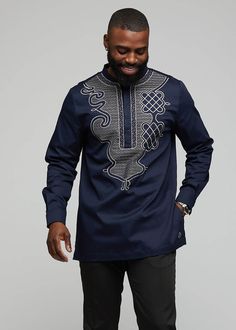 Style#: M2042NVY Inspired by traditional African attire, this is an essential top for a cultured gentleman. Wear this traditional shirt for special occasions and pair it with dress pants. For a more casual look pair our multi-purposed shirt with blue jeans. Description Long sleeve shirt with cuff Embroidery design on the front 97% Cotton/ 3%Lycra Stretch Sateen Care Instructions: COLD WASH. DO NOT BLEACH. DRY CLEAN ONLY. DO NOT TUMBLE DRY. Model: 6' | Size Medium Fitted Long Sleeve Tops With Traditional Patterns, Traditional Long Sleeve Shirt With Patterns, Casual Long Sleeve Top With Traditional Patterns, Traditional African Attire, Cuff Embroidery, African Embroidery, African Tops, Dope Shirt, Embroidery Shirt