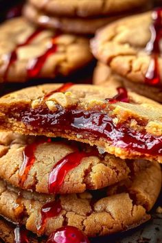 several cookies stacked on top of each other covered in jelly