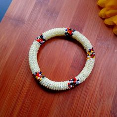 1pc Beautiful Women's White Maasai White Beaded Round Bracelet. Traditional White Bracelets With Polished Beads, Traditional White Stretch Bracelet With Round Beads, Traditional White Round Beads Stretch Bracelet, Traditional White Round Bead Stretch Bracelet, Traditional Yellow Beaded Bracelets With Polished Beads, White Beaded Bangle Bracelets For Festival, White Beaded Bangle Bracelet With Large Beads, White Large Bead Bangle Bracelets, White Beaded Bangle Bracelets With Large Beads