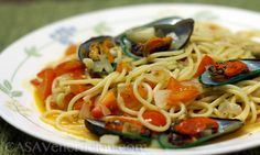 pasta with clams and tomatoes on a plate