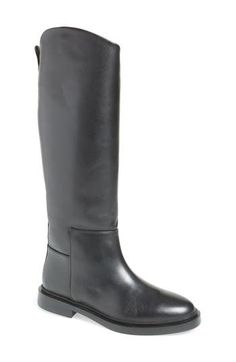 An angled shaft lends visual intrigue to a smooth leather riding boot ready to make your outfit complete. 1" heel 14 1/2" shaft; 14 3/4" calf circumference Pull-on style Leather upper/textile and synthetic lining/synthetic sole Imported Make Your Outfit, Womens Riding Boots, Black Riding Boots, Riding Boot, Leather Riding Boots, Boot Shoes Women, Smooth Leather, Riding Boots, Steve Madden