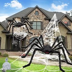 a house decorated for halloween with spider webs