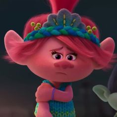 an animated character with pink hair and blue dress standing in front of a green frog