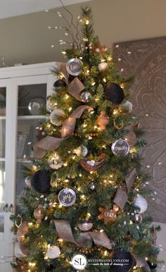 a christmas tree decorated with ornaments and lights