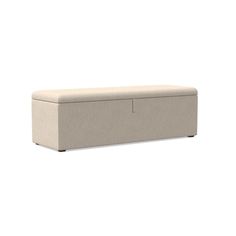 a beige bench sitting on top of a white floor