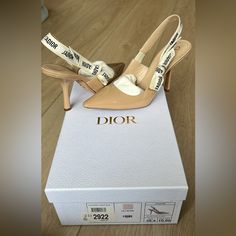 Nude Dior Slingbacks. Worn Twice. Signs Of Wear Only On Soles Of Shoes And One Tiny Mark That Is Not Noticeable On Side. Authentic And Has Receipts And Cards For Proof. Designer Beige Pointed Toe Slingback Pumps, Designer Beige Slingback Pumps With Pointed Toe, Designer Beige Slingback Pumps With Heel Strap, Luxury Beige Slingback Pumps, Designer Beige Slingback Heels, Designer Slingback Pumps With Padded Heel, Designer Beige Slingback Pumps For Formal Occasions, Designer Slingback Pumps For Spring, Designer Beige Slingback Pumps For Summer