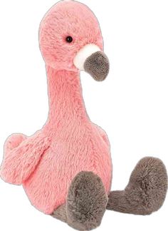 a pink stuffed bird sitting on the ground