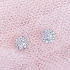 Classic diamond halo round stud earrings 0.80 carat total weight round brilliant diamonds in center 0.10 carat total weight round brilliant diamond melees in halo 14k This item is low in stock. Please reach out to us for updated availability. In stock items will ship within 3-5 business days and backordered items are made to order and will take 8-10 weeks for sourcing and production. For sensitive timelines, please email info@theclassicgem.com to inquire further. Diamond Cluster Earrings With Halo Setting, Lab Grown Diamond Halo Earrings, Round Lab Grown Diamond Earrings With Halo Design, Dazzling Round Cluster Earrings With Halo Setting, Halo Round Lab-grown Diamond Earrings, Round Lab Grown Diamond Earrings With Pave Setting, Authentic Jewelry, Round Stud Earrings, Diamond Halo