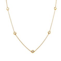 An iconic and classic style of necklace to layer or wear on its own! This chic 18” round diamond station necklace features .95 total carats of diamonds in 14 karat yellow gold. Ten (10) Round Brilliant cut diamonds are set in secure bezels, thoughtfully punctuating the classic chain necklace. The diamonds are near colorless and sparkle when touched with light. The chain is simple and modern, functional, and easy to layer. A true timeless beauty that would make a great gift for any loved one! Classic Gold Station Necklace With Brilliant Cut, Luxury Round Station Necklace With Bezel Setting, Classic Gold Station Necklace With Single Cut Diamonds, Luxury Diamond Station Necklace With Bezel Setting, Classic Yellow Gold Diamond Station Necklace, Classic Yellow Gold Station Necklace For Anniversary, Classic Yellow Gold Station Necklace With Brilliant Cut, Yellow Gold Bezel Setting Station Necklace, Classic Gold Diamond Necklace With Rose Cut Diamonds