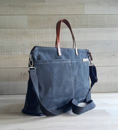 "This waterproof waxed canvas tote bag is not super large & big but it does handy to carry around and does the job to store your essentials in order and light pack. Measurements: (It can be made in other sizes too, please contact me ) ~17 1/2 inches across the opening (45 cm) ~11 1/2 inches high (30 cm) ~4.5 inches deep (12 cm) double strap : 14 1/2\" (37 cm) removable strap : from 27\" to 50\" (68cm to 127 cm) FEATURES. Sturdy & durable material that made of canvas with water-resistant Waxed Canvas Bag With Leather Handles For On-the-go, Everyday Laptop Bag With Pockets In Standard Backpack Style, Black Cotton Canvas Bag For On-the-go, Everyday Practical Canvas Bag With Leather Handles, Everyday Cotton Satchel With Canvas Lining, Practical Canvas Bag With Leather Handles For Everyday Use, Practical Everyday Canvas Bag With Leather Handles, Everyday Canvas Shoulder Bag With Reinforced Handles, Canvas Shoulder Bag With Reinforced Handles For Everyday Use