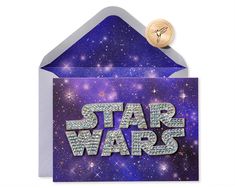 a card with the word star wars on it and a button in front of it