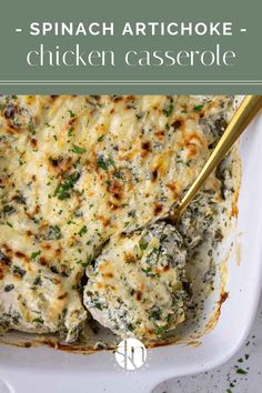 spinach artichoke chicken casserole in a white dish