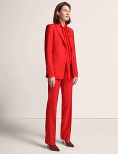 Classic Fall Pantsuit With Notch Lapel, Tailored Fall Suit With Structured Boning, Classic Fall Pantsuit For Tailoring, Fall Fitted Pantsuit With Structured Boning, Fitted Wool Pantsuit For Fall, Wool Pantsuit With Notch Lapel For Tailoring, Fall Wool Tuxedo Blazer, Fitted Pantsuit With Pressed Crease For Fall, Fall Tuxedo Suit With Notch Lapel