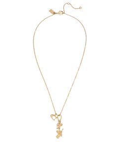 a gold necklace with the word love on it and a small key hanging from the front