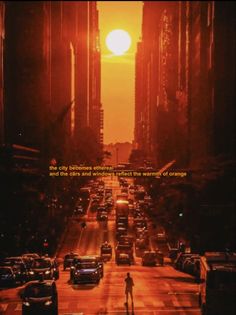 a man walking across a street in front of tall buildings with the sun behind him