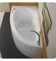 an oval shaped bathtub sits in the corner of a bathroom