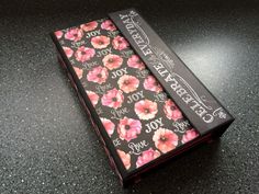 a black box with pink flowers on it