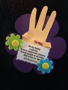 a hand made out of paper with flowers and a poem on it that says, oh my home