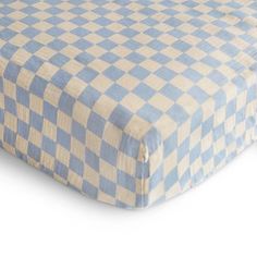 a blue and white checkered bed spread