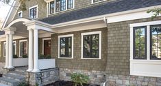 a house with stone steps leading up to the front door